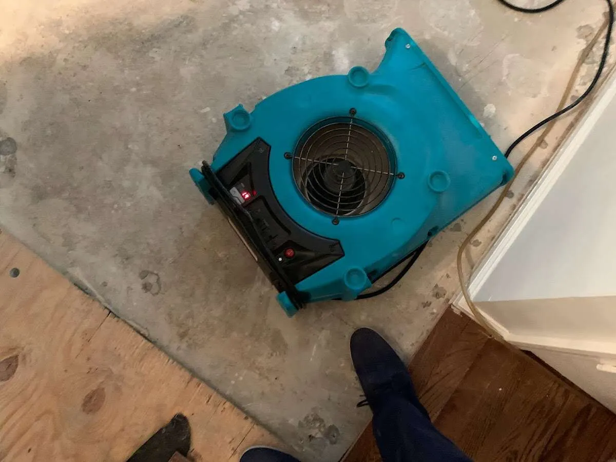 Air mover drying subfloor during Leak Detection & Repair in Lower Makefield